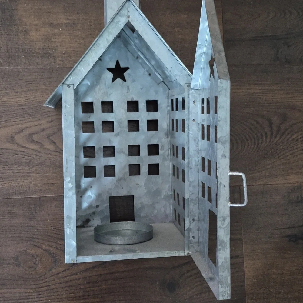 Metal House Lantern with Star Cutout, holds pillar candle